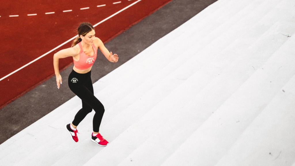 Badger Compression Gear on girl running up stairs